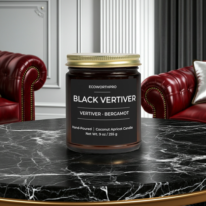 ECOWORTHPRO BLACK VETIVER luxury vetiver candle on a black marble table in a contemporary living room with chairs, masculine bergamot scented candle in reusable glass jar